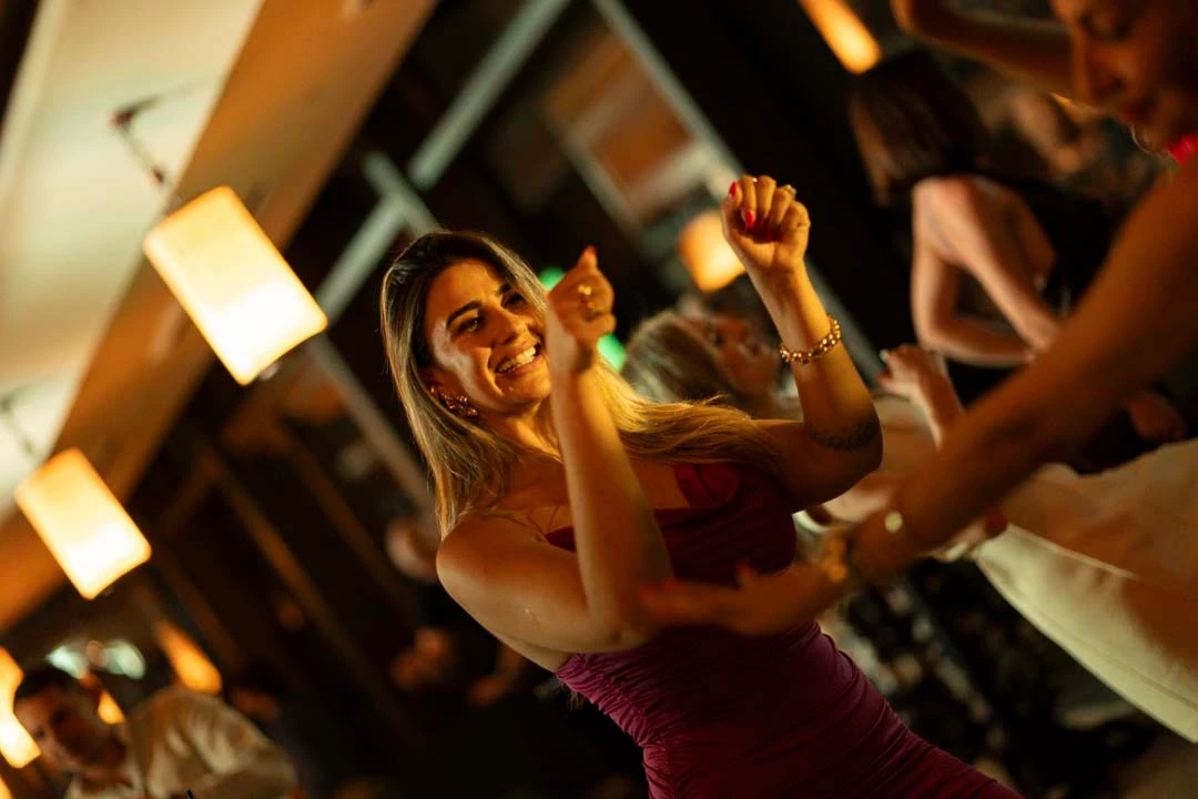 Guests smiling and celebrating during an Altitude evening