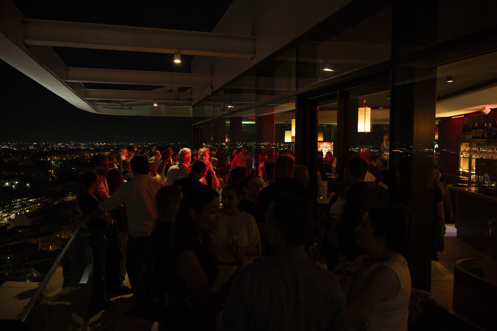 Guests gathering inside Skyfall Cocktail Club at the Barcelona Altitude evening