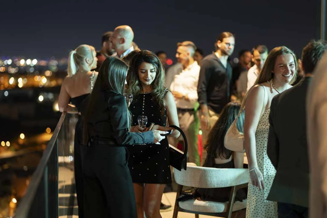 Guests connecting on the terrace at Altitude Malta