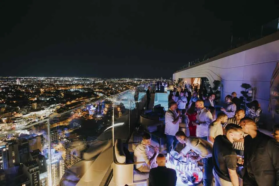 Guests overlooking the city skyline · Noyane · September 2024
