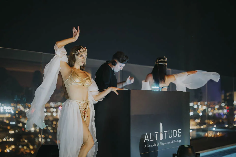 A performer above the rooftop crowd · Noyane · September 2024