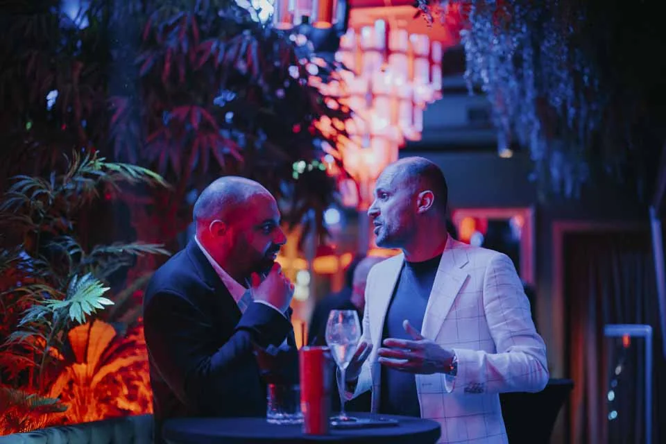 Guests in conversation · Mamachi, St Julian’s