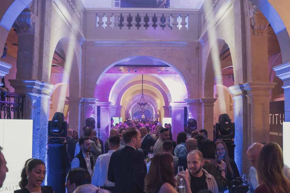 Guests beneath the historic arches · Civil Service Club, Valletta