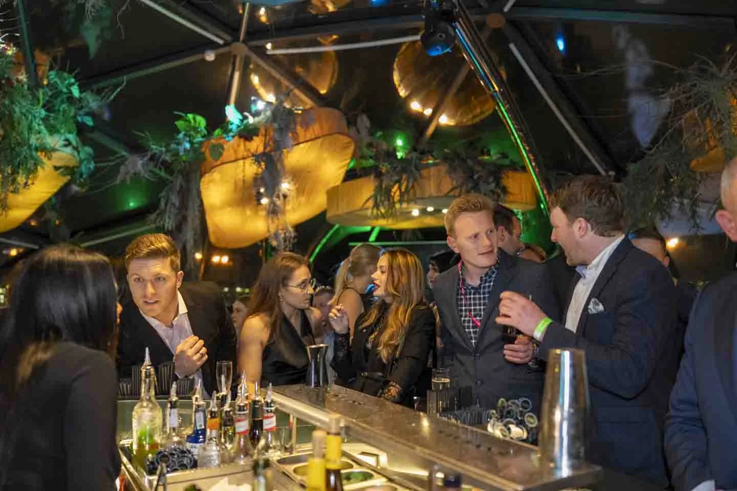 Conversations around the cocktail bar · Everything is possible
