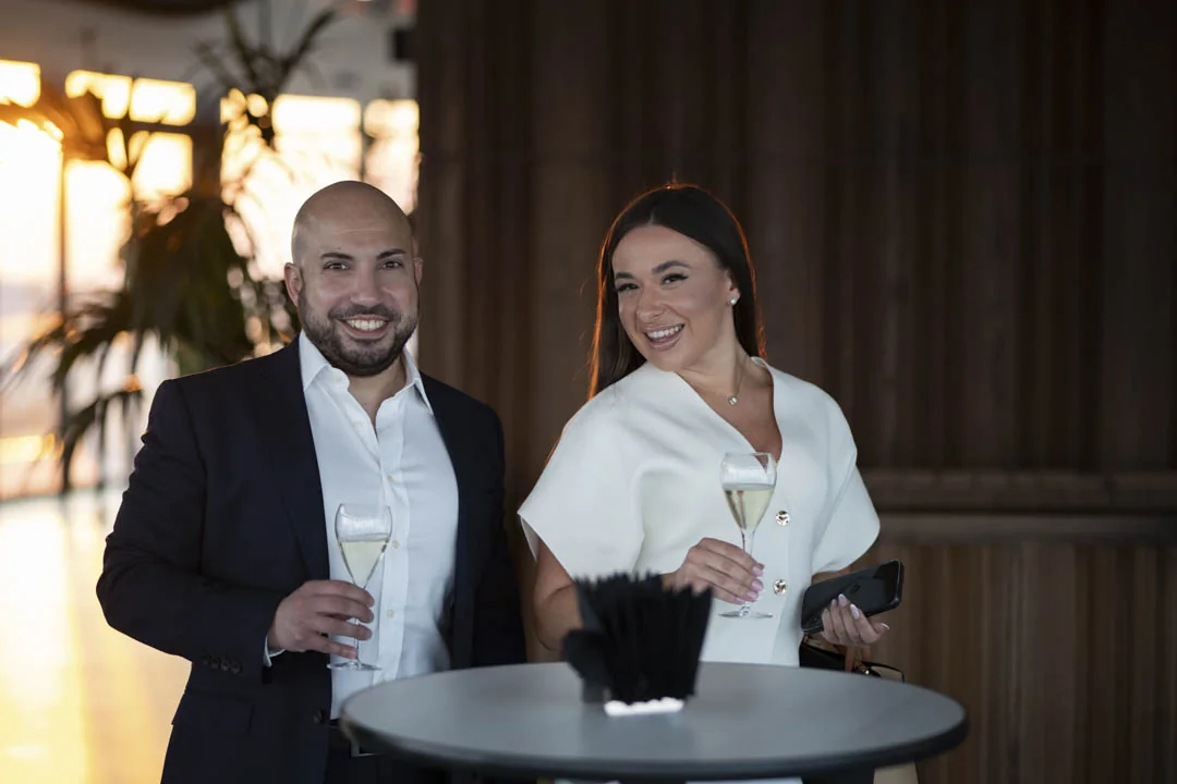 A conversation over drinks · Above the island