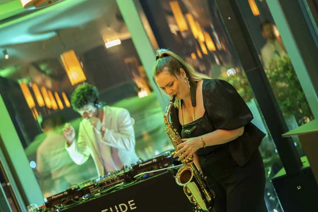 A live saxophone performance · Above the island