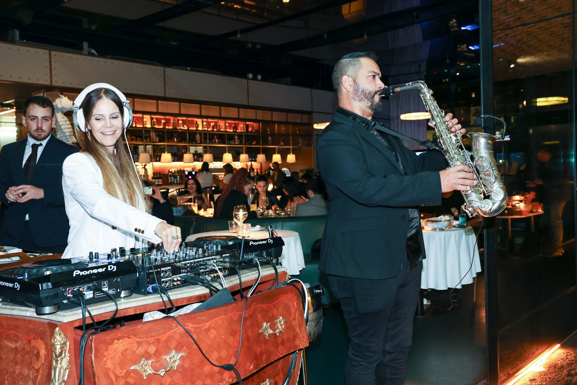 The DJ and live saxophonist performing together at Altitude Lisbon 2026.
