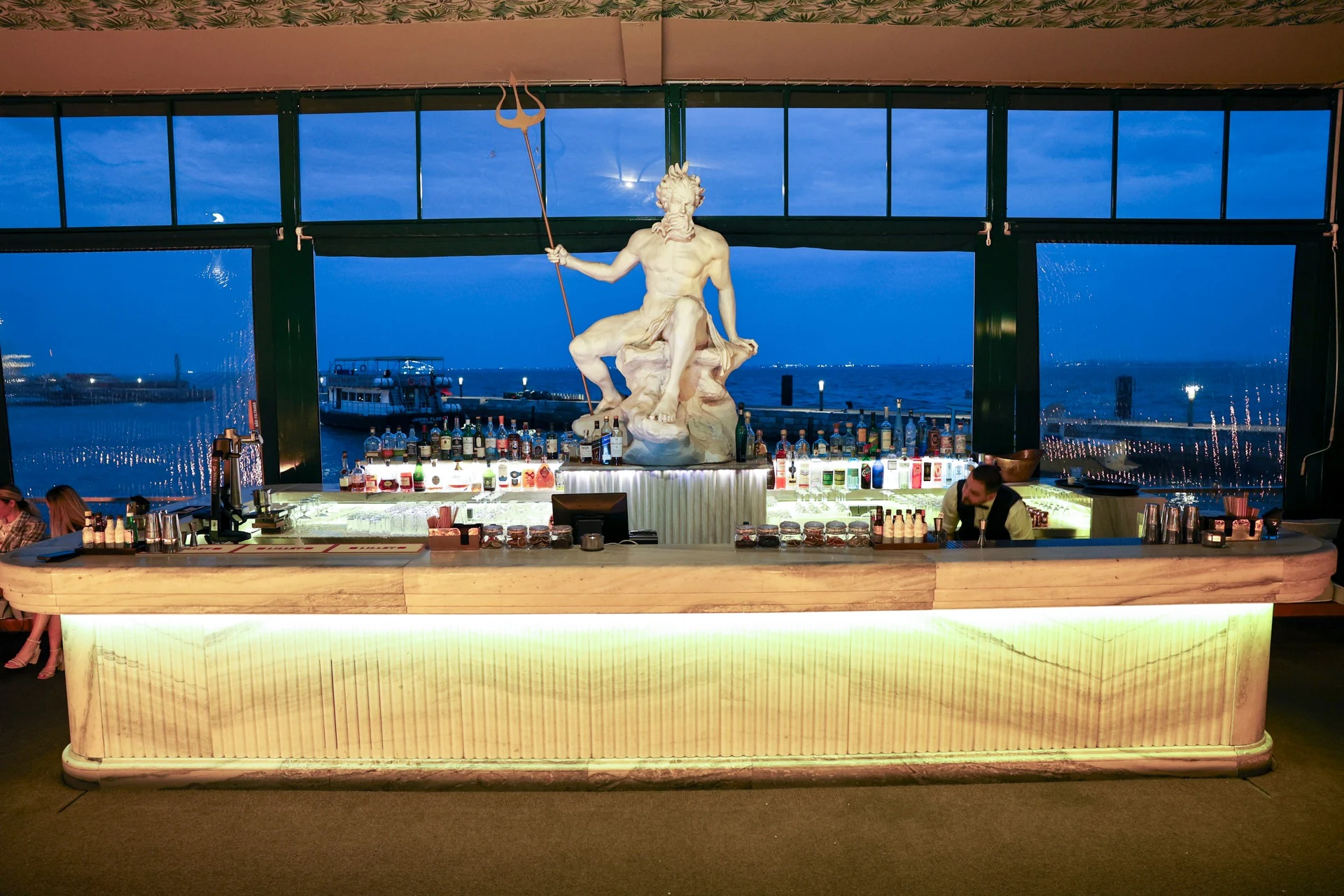 The illuminated bar and sculptural centrepiece at ÀCosta by Olivier in Lisbon.
